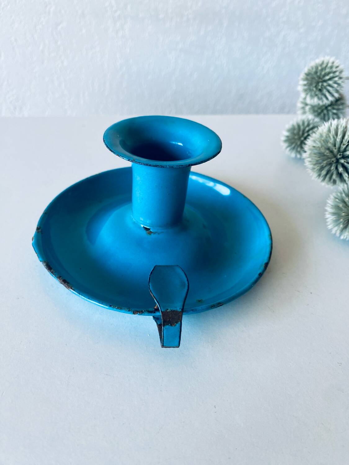 Antique enamelled metal candle holder