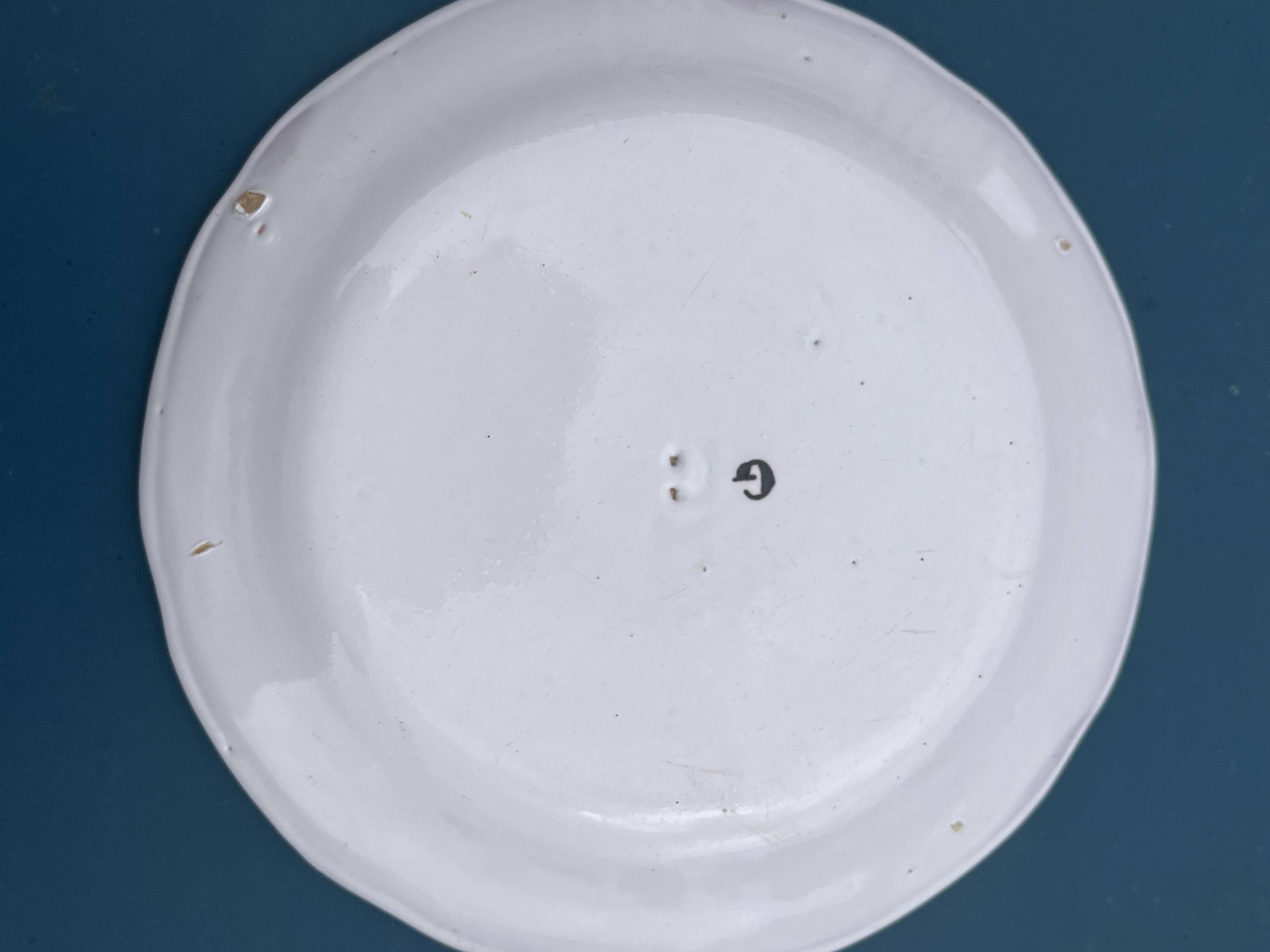 Two very old earthenware plates from the East.