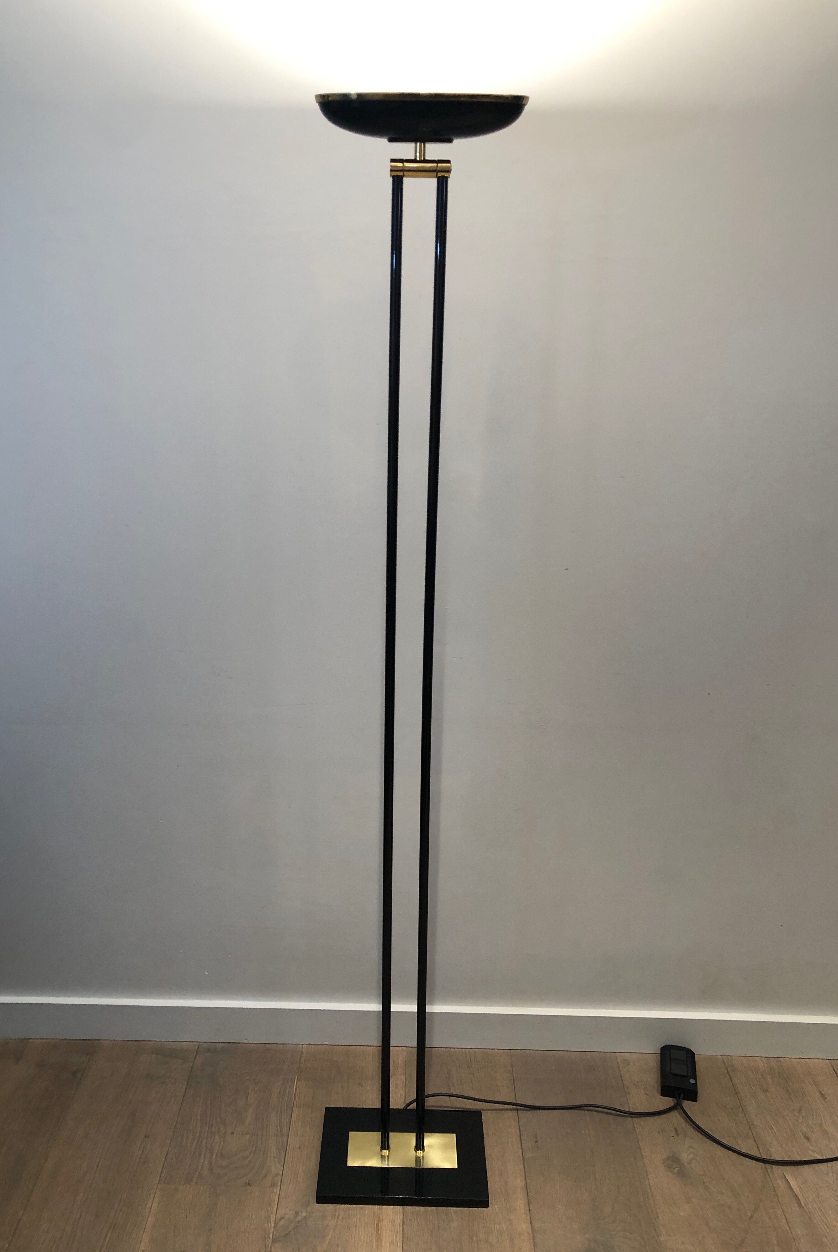 Floor lamp in black lacquered metal and brass