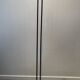 Black lacquered metal floor lamp with brass.
