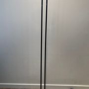 Black lacquered metal floor lamp with brass.