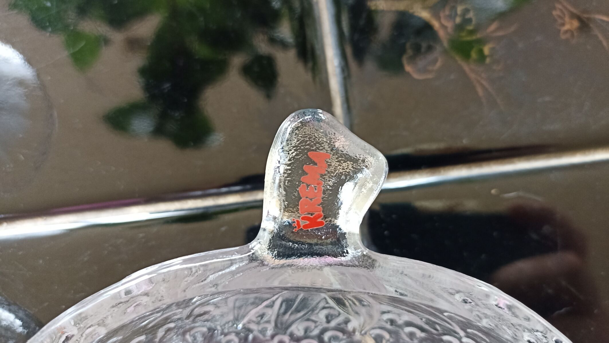 Two molded glass cups in the shape of strawberry and pineapple