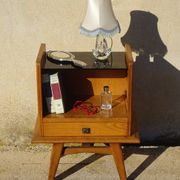 Vintage oak bedside table with tapered legs.
