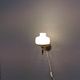 Older wall lamp, in metal, brass and milk-white glass