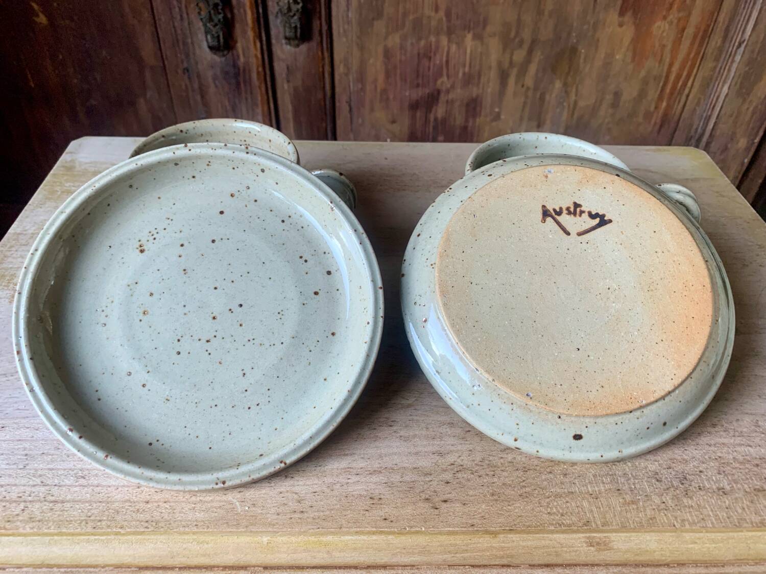 Two large Jean Austruy stoneware cups and saucers