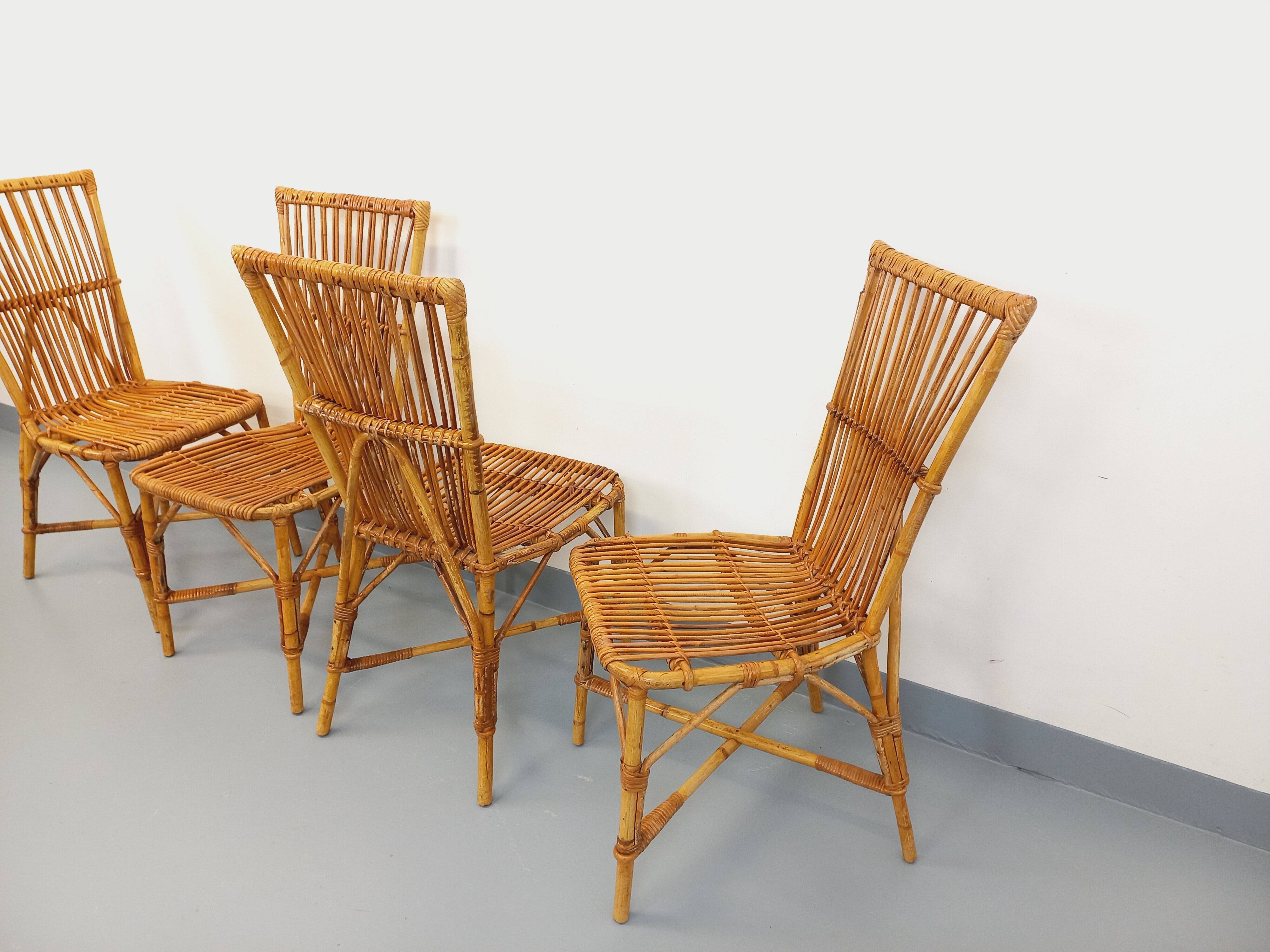 Set of 4 vintage Audoux Minet rattan chairs from the 1950s and 60s.