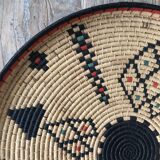 Braided wicker dish with ethnic motifs