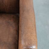 Vintage sheepskin armchair with warm colours and a characterful appearance