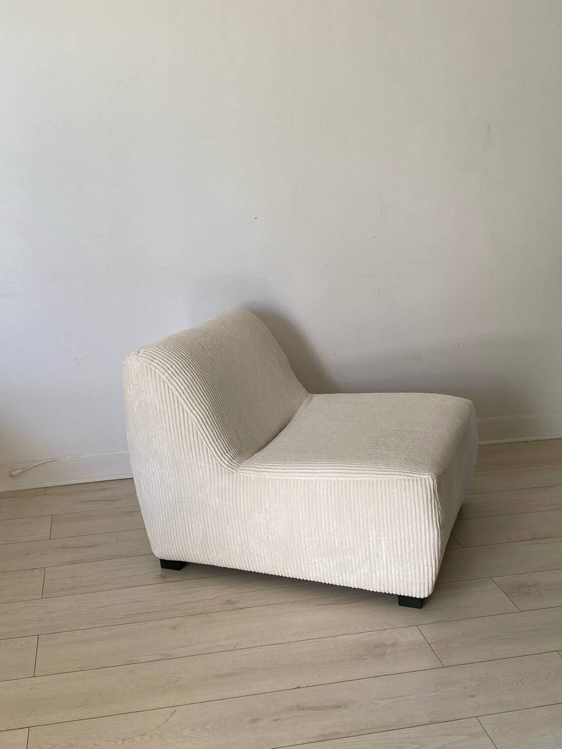 White corduroy armchair