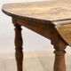 Louis Philippe wood dining table with shutters and casters