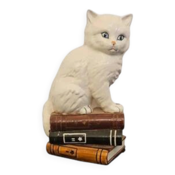 Vintage porcelain decorative cat figurine with blue eyes on books - Italy