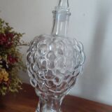 Old carafe in pressed glass grape cluster style