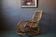 Vintage rocking chair in rattan from the 60s-70s, high openwork backrest.