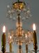 Gilded bronze chandelier trimmed with drop-shaped stamps