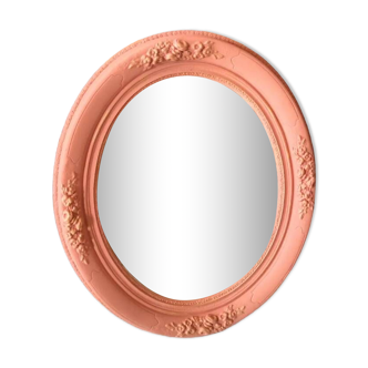 Oval terracotta mirror with pink shapes in resin