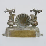 Old bathtub faucet, kitchen in silvered bronze with its shell-shaped soap dish