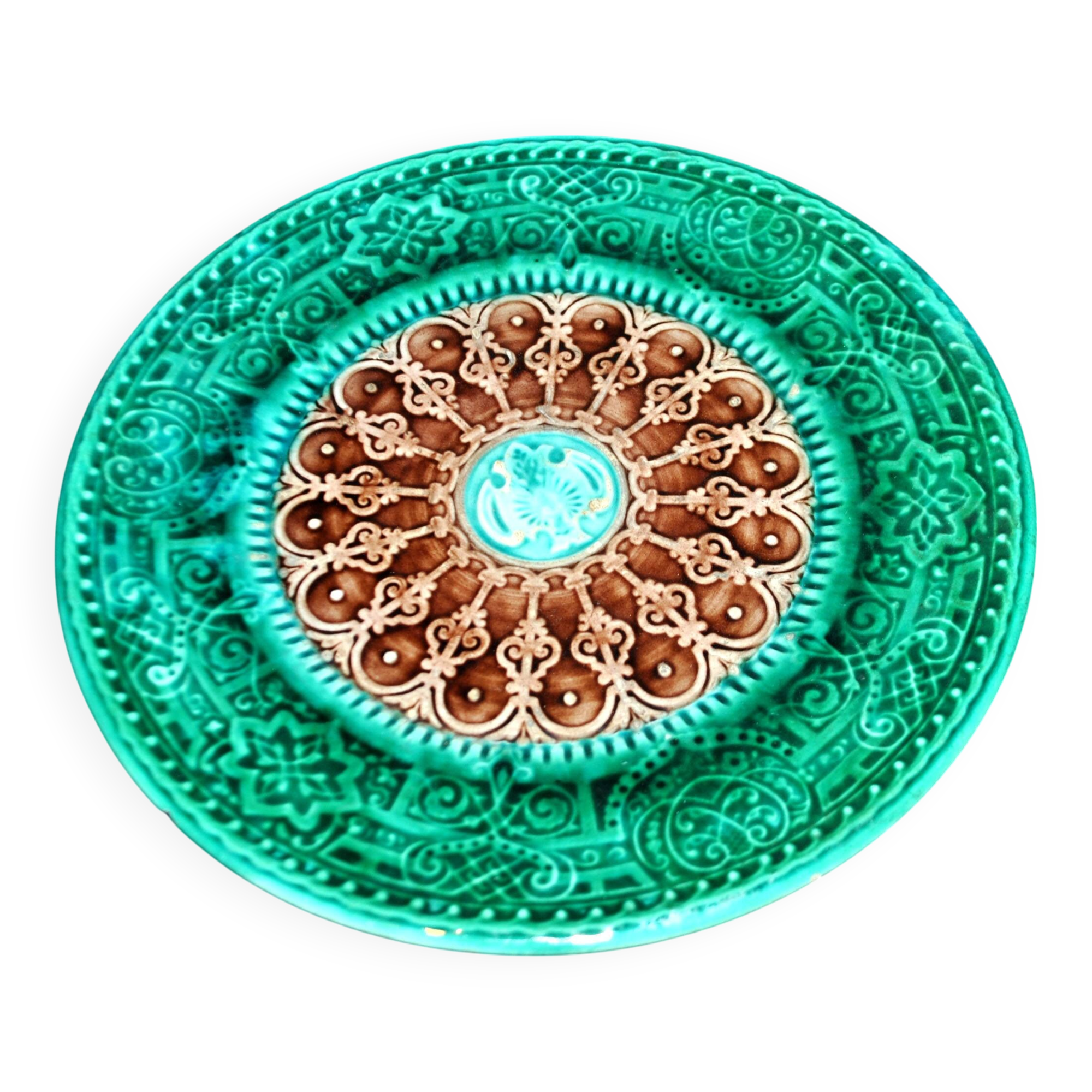 Antique plate in turquoise brown green slip with arabesque decoration