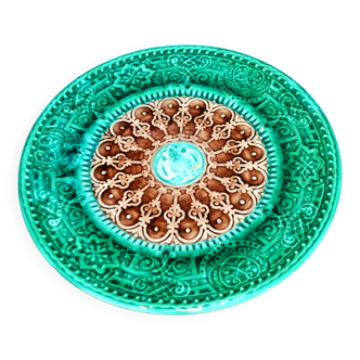 Antique plate in turquoise brown green slip with arabesque decoration