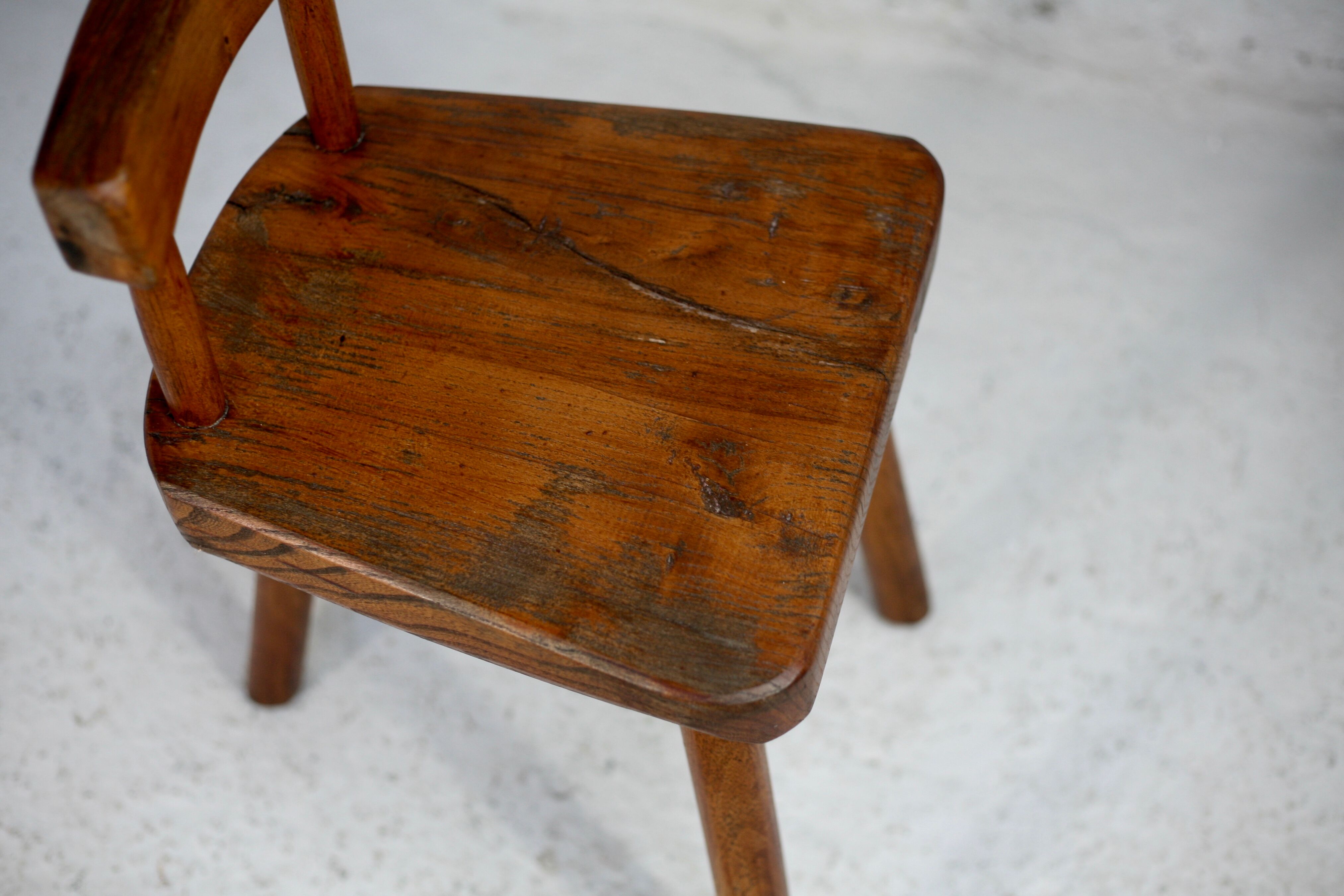 Pair of tripod stools with brutalist backrests, France, circa 1960