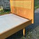 Read a vintage wooden and cane bed, with compass legs – mattress 80 × 190 cm.