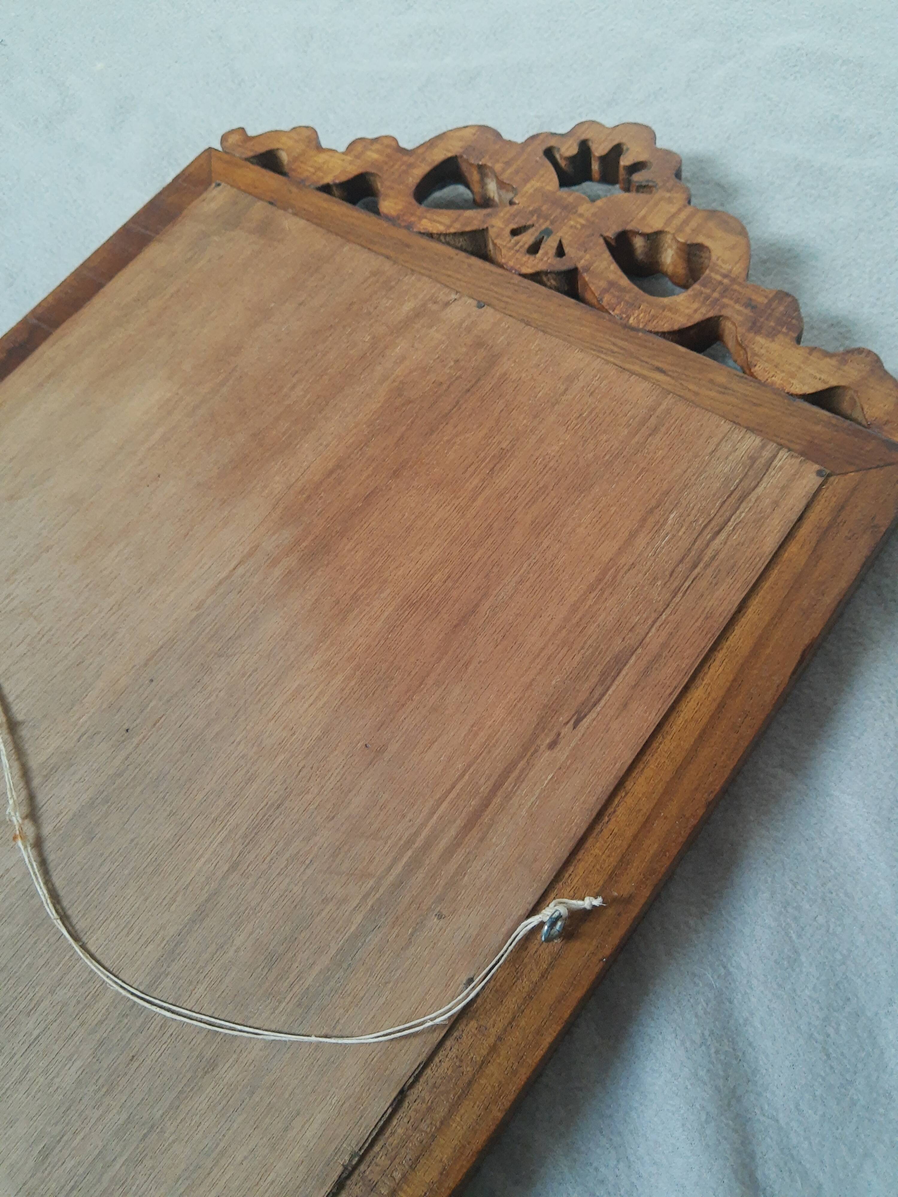 Wooden hanging mirror with vintage carved knot
