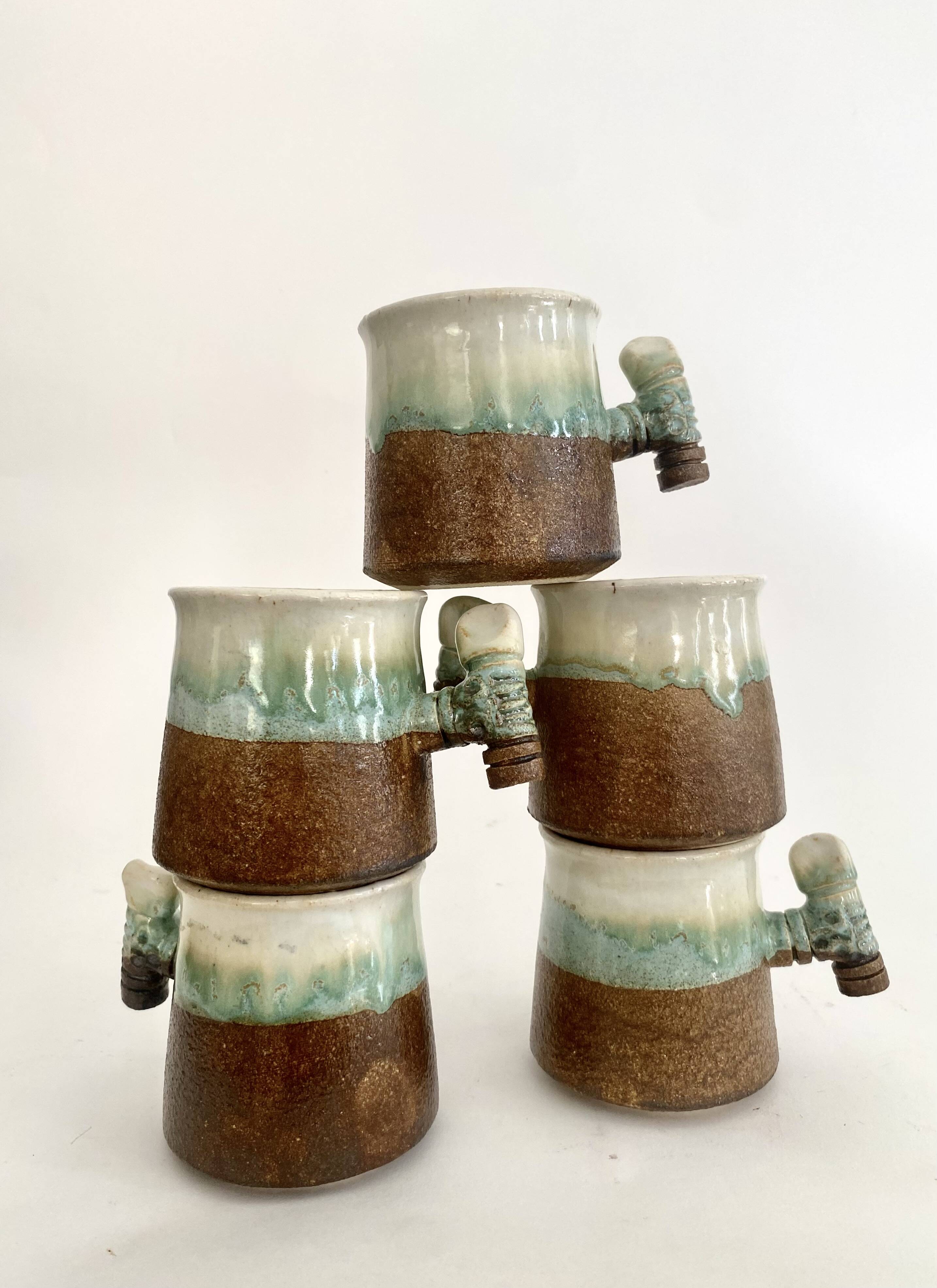 5 glazed and scarified ceramic cups