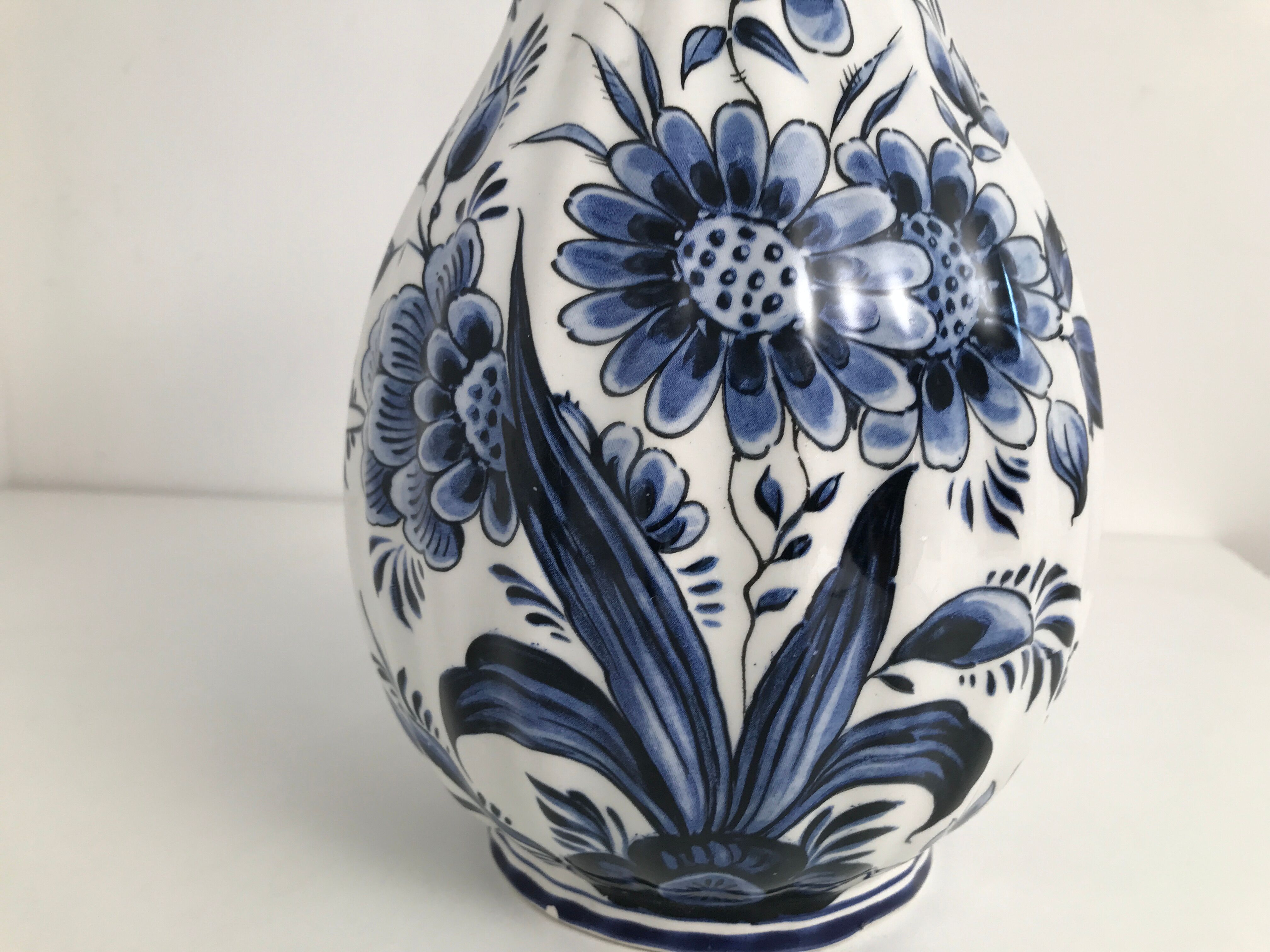 Vase with vintage blue and white flower pattern signed