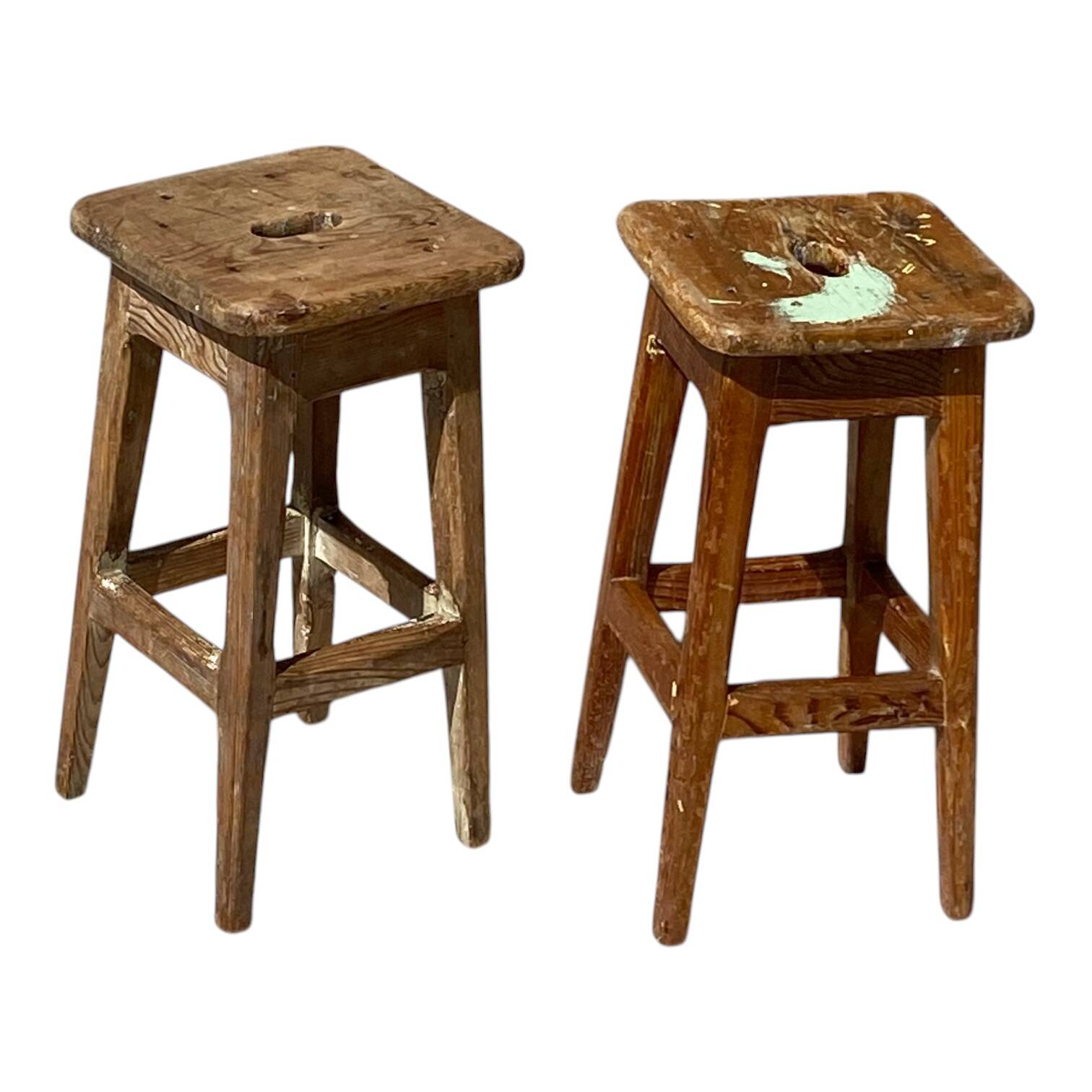 Pair of vintage wooden workshop stools with a patina.