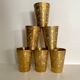 Six chiseled metal glasses