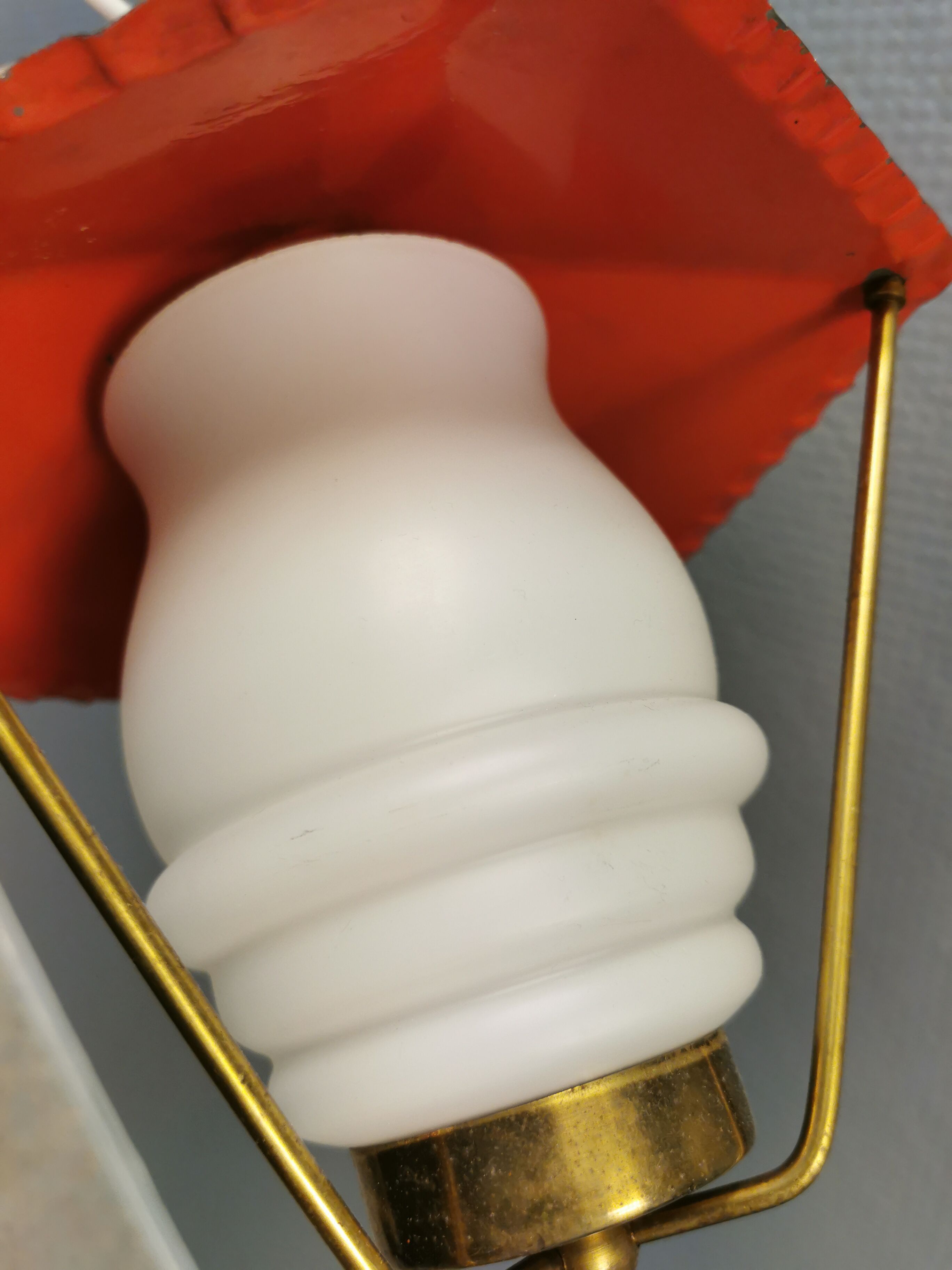 Danish hanging lamp from the 50-60s, made of brass, metal and with milky white glass shade.