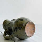 Small handcrafted ceramic pitcher with spotted enamel