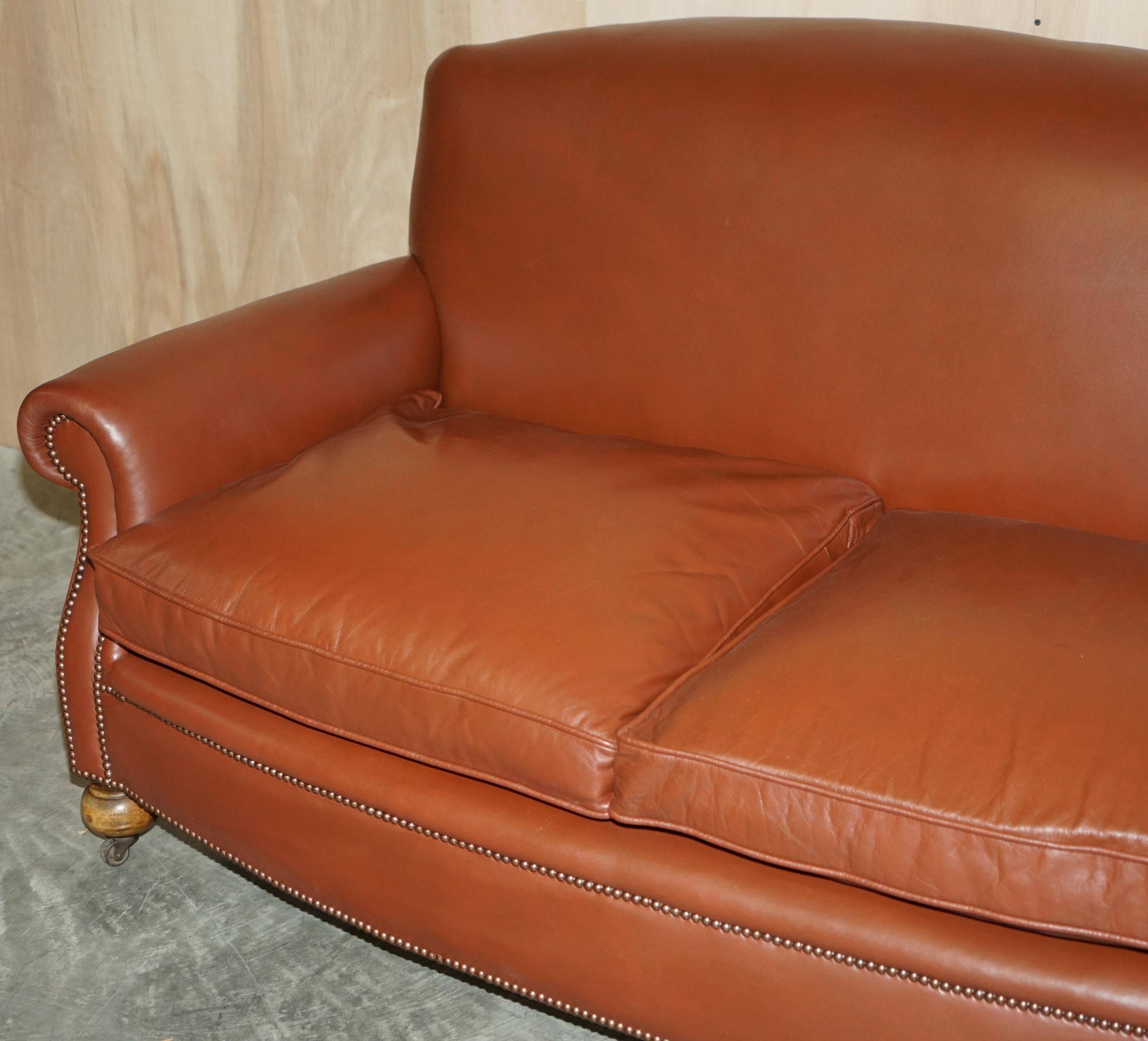 Edwardian leather club canapé circa 1910 with feather cushions.
