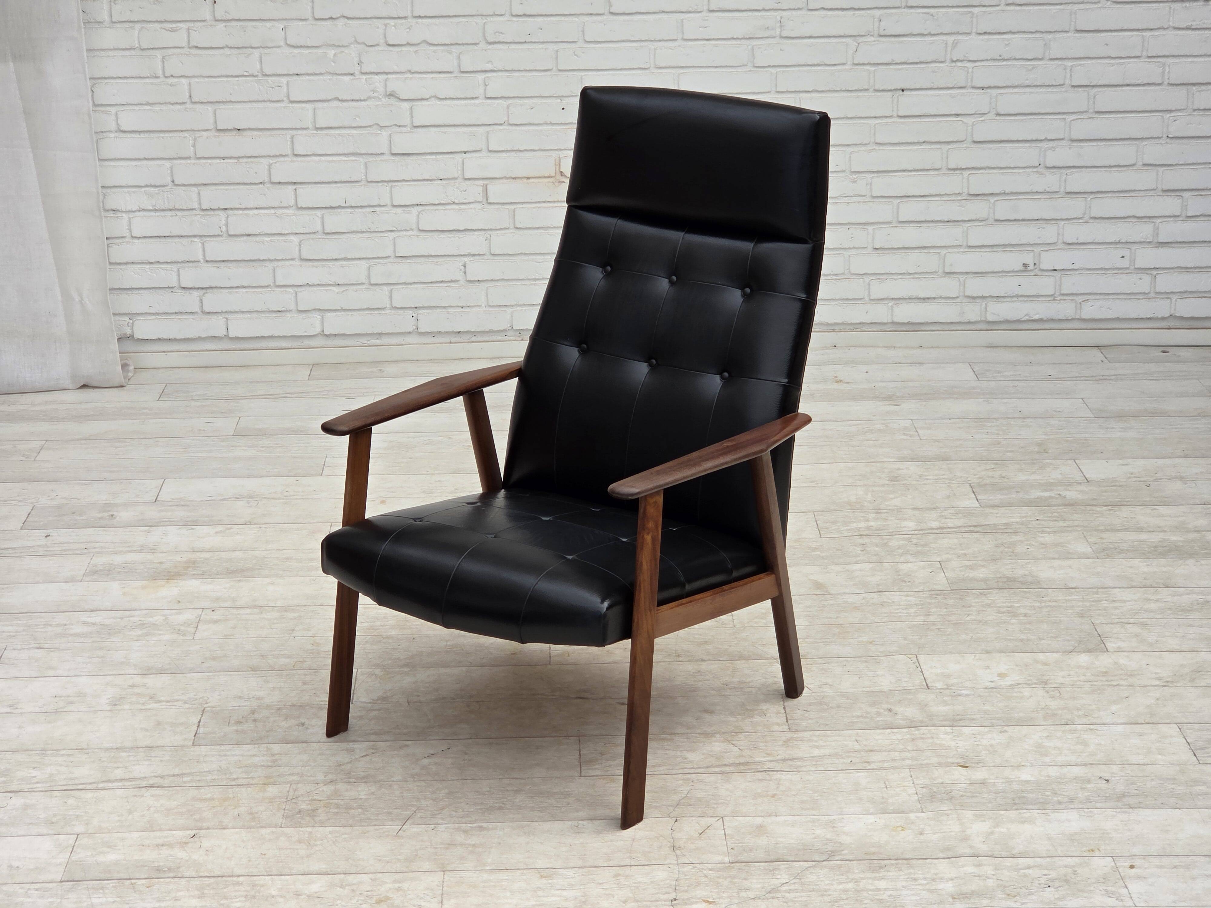 1970s, Danish armchair, black artificial leather, teak wood.