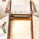 Old wooden rocking footrest with velvet fabric