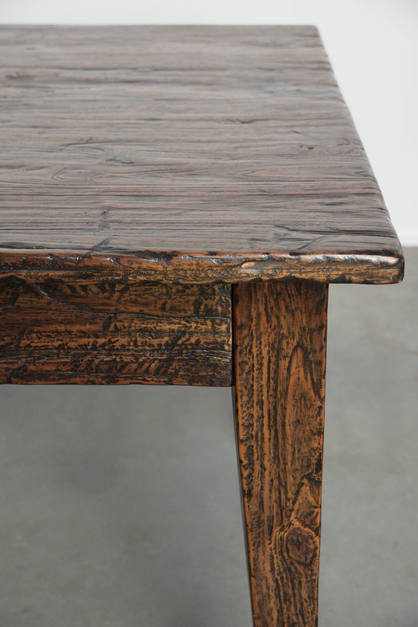 Large rustic dining table made of atmospheric elm wood with fine details