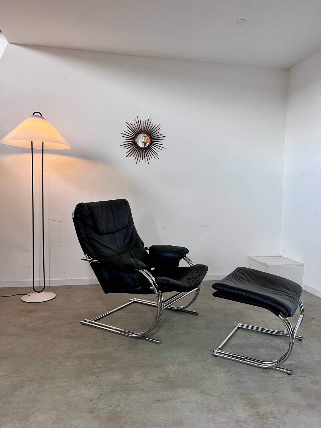 Old armchair and ottoman black leather tubular chrome bauhaus design from the 70s