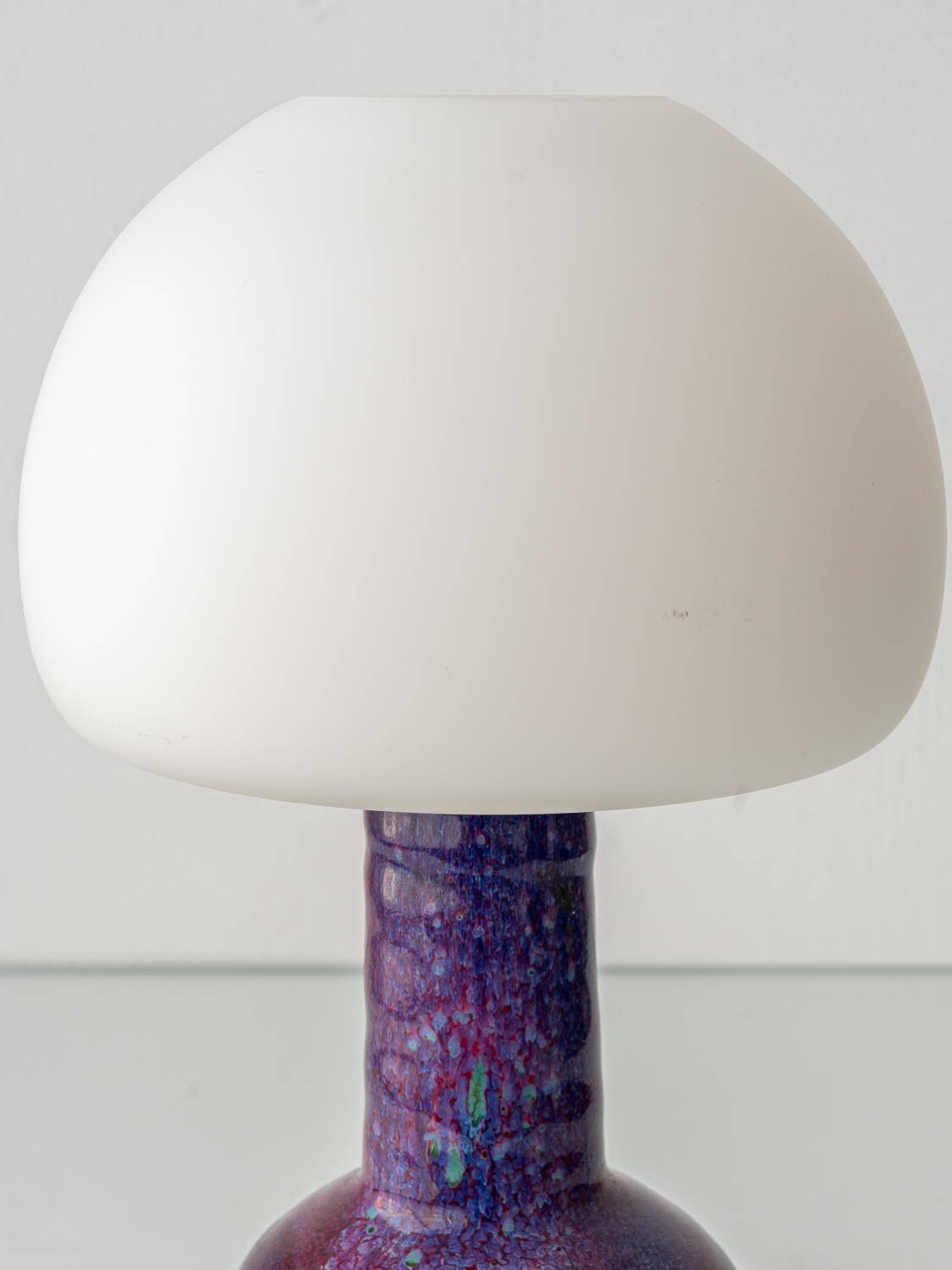 Mid-century modern table lamp by Jaap Ravelli, ceramic base and glass shade.