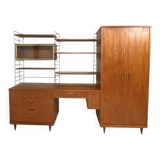 A piece of furniture combining a desk, wardrobe, and shelves.