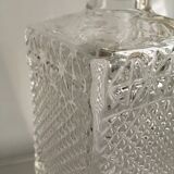 Bottle of whisky in chiseled glass