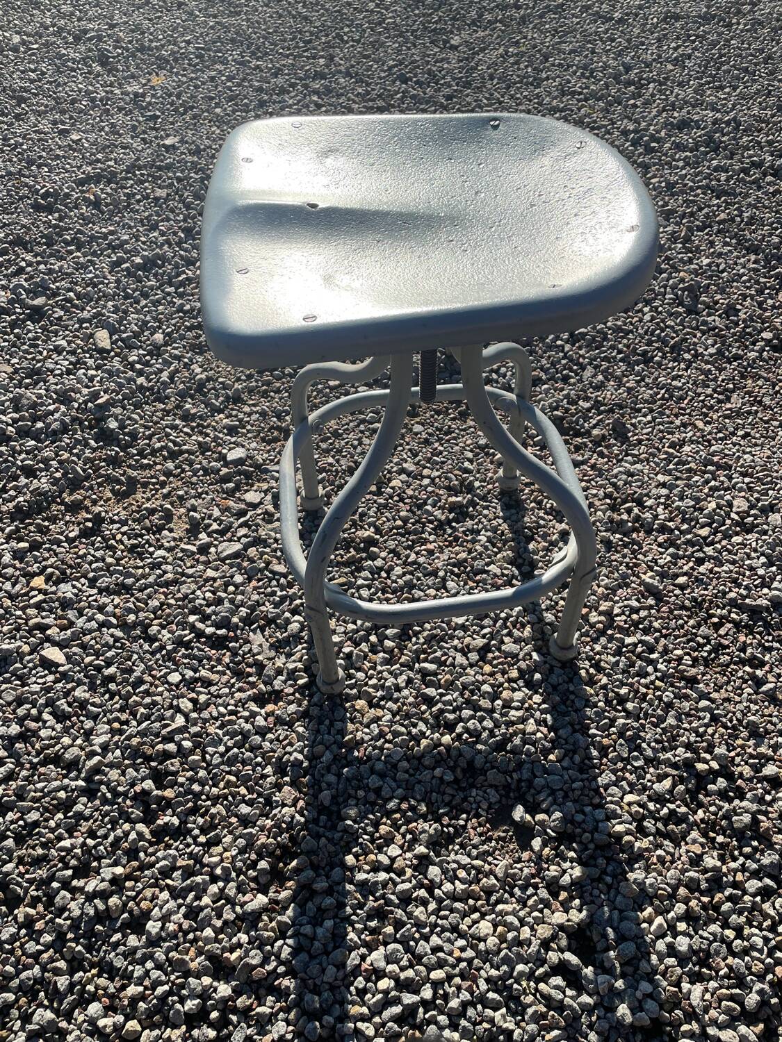 Old metal stool from a factory industrial workshop