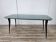 Mid-century mahogany dining table with aquamarine glass top
