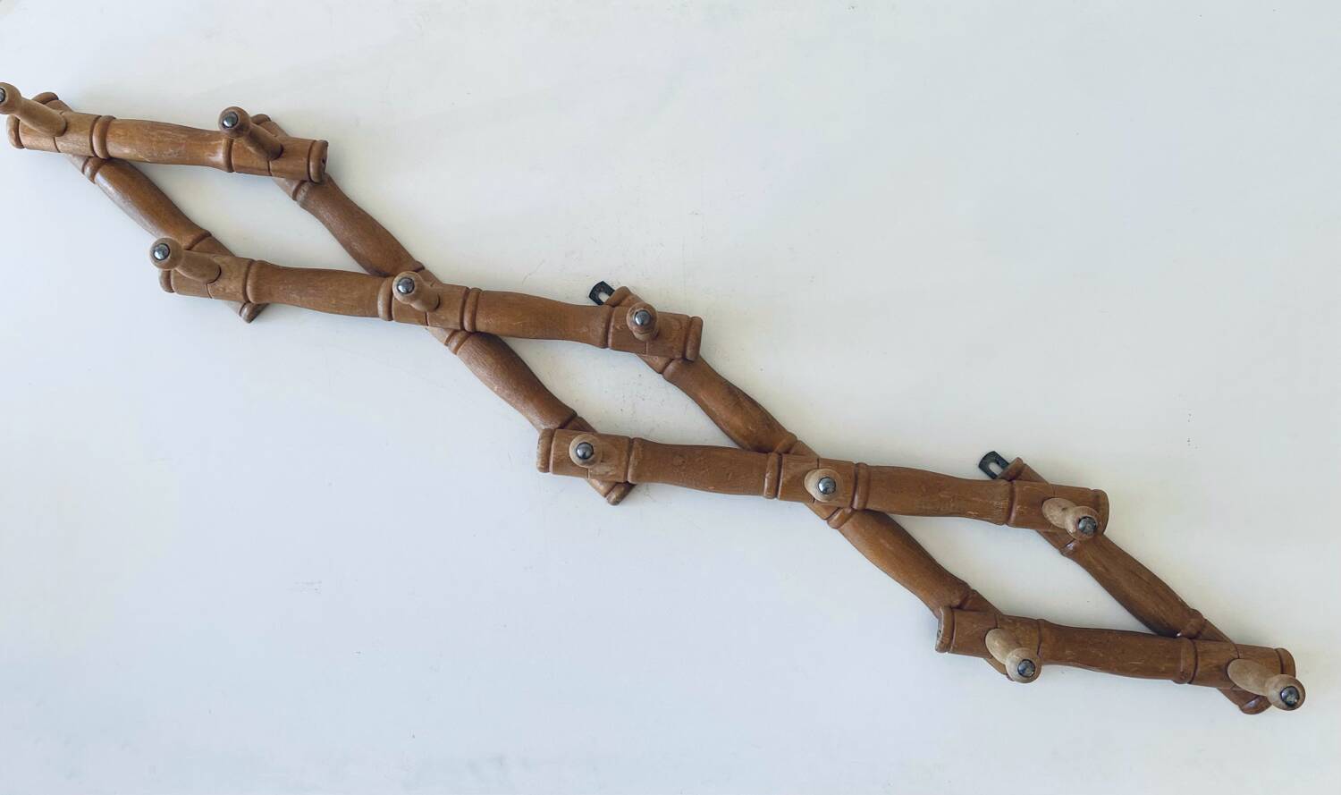 Old wooden wall coat rack