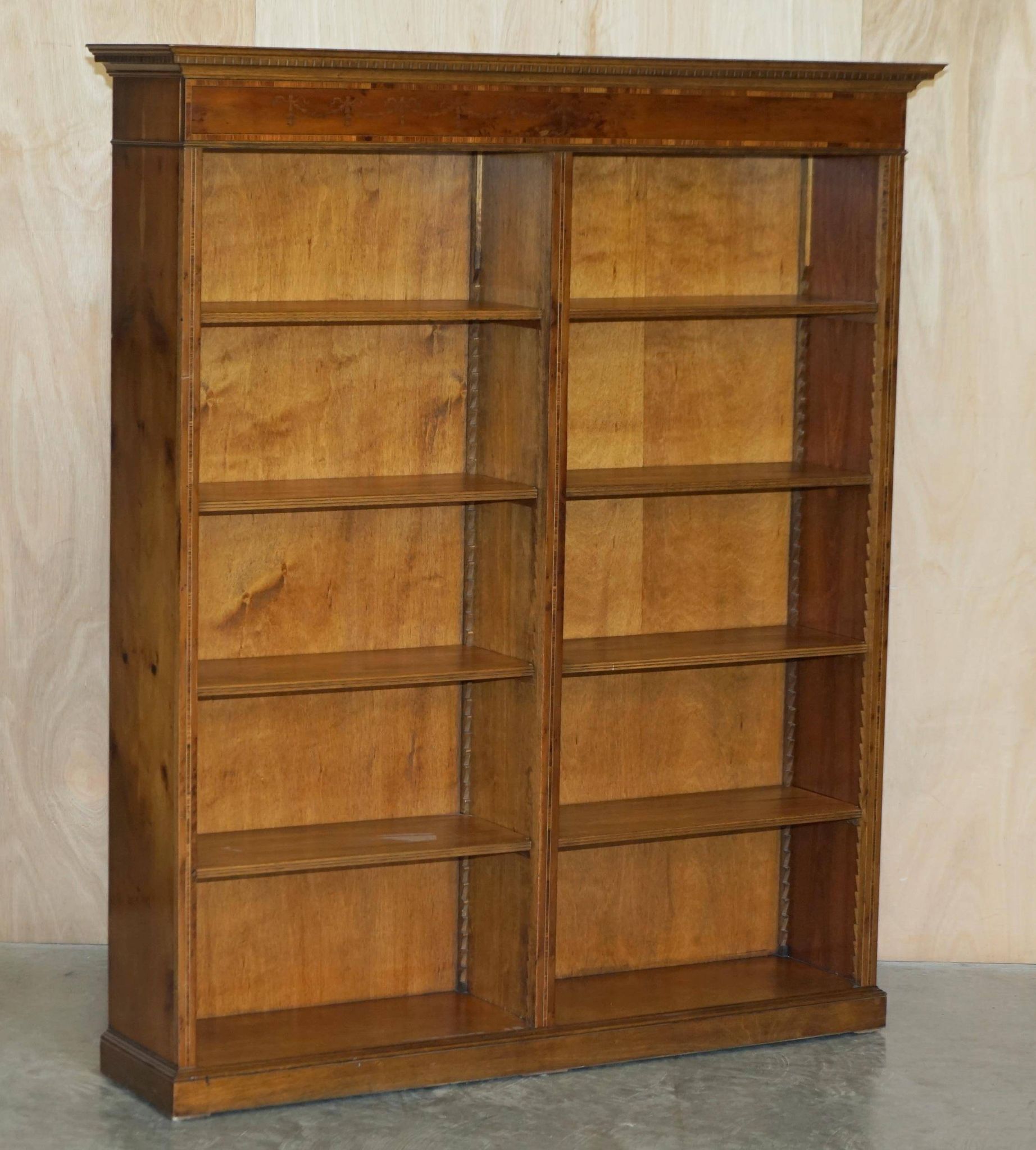 Pair of Sheraton Revival bookcases in satinwood, walnut, and yew.