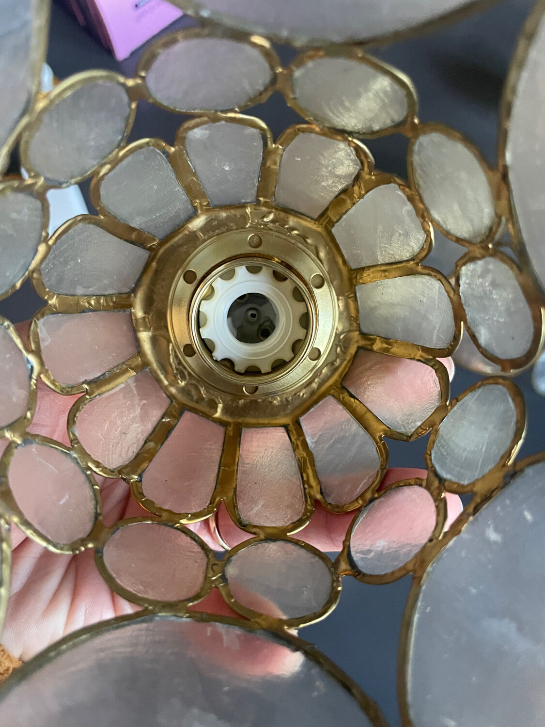 Pair of portable lamps with mother-of-pearl lampshades and brass.