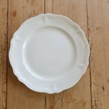 Round vintage ivory earthenware serving dish with scalloped rim.