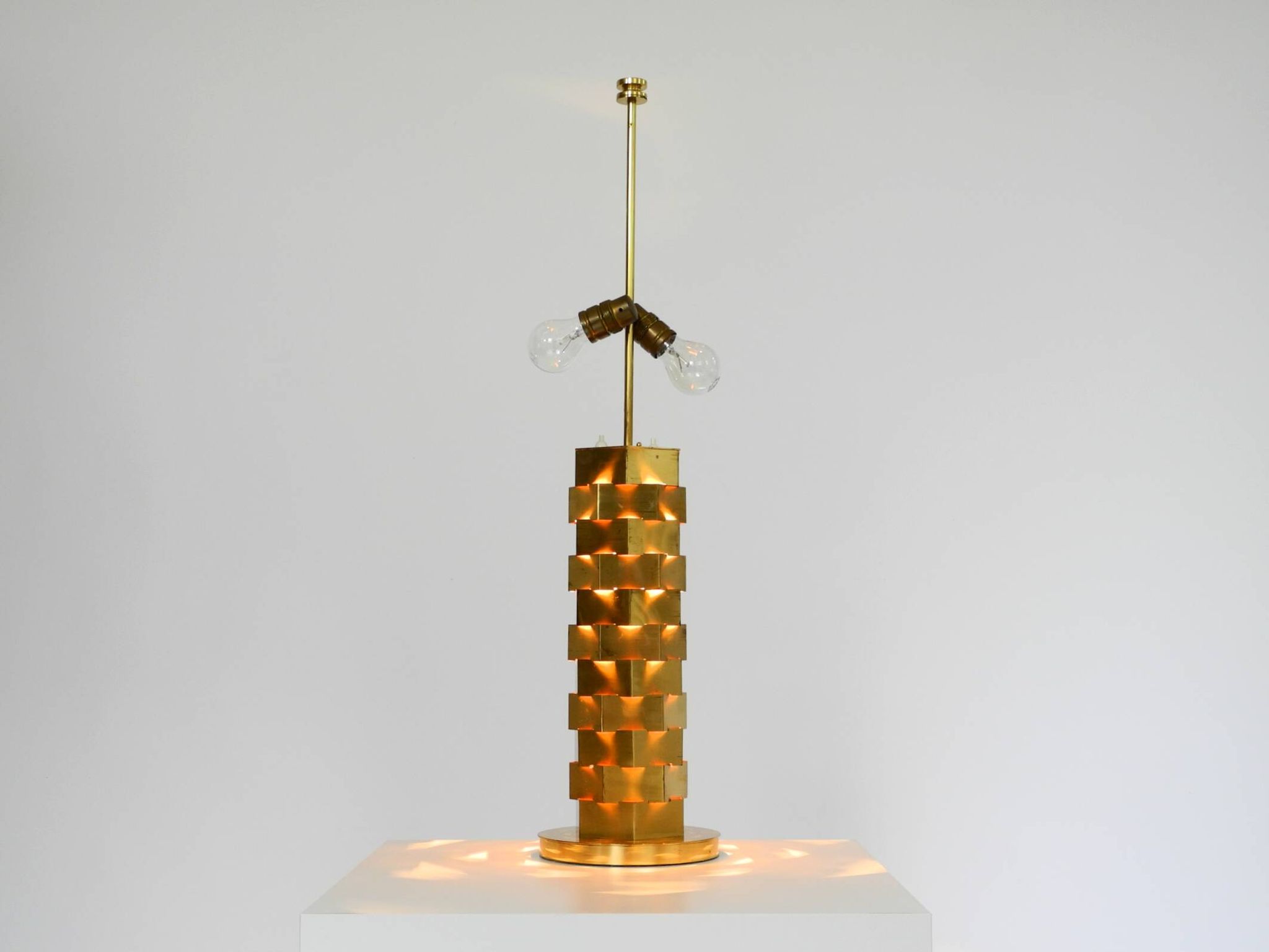 1960s brass table lamp by Vereinigte Werkstätten with an illuminated base