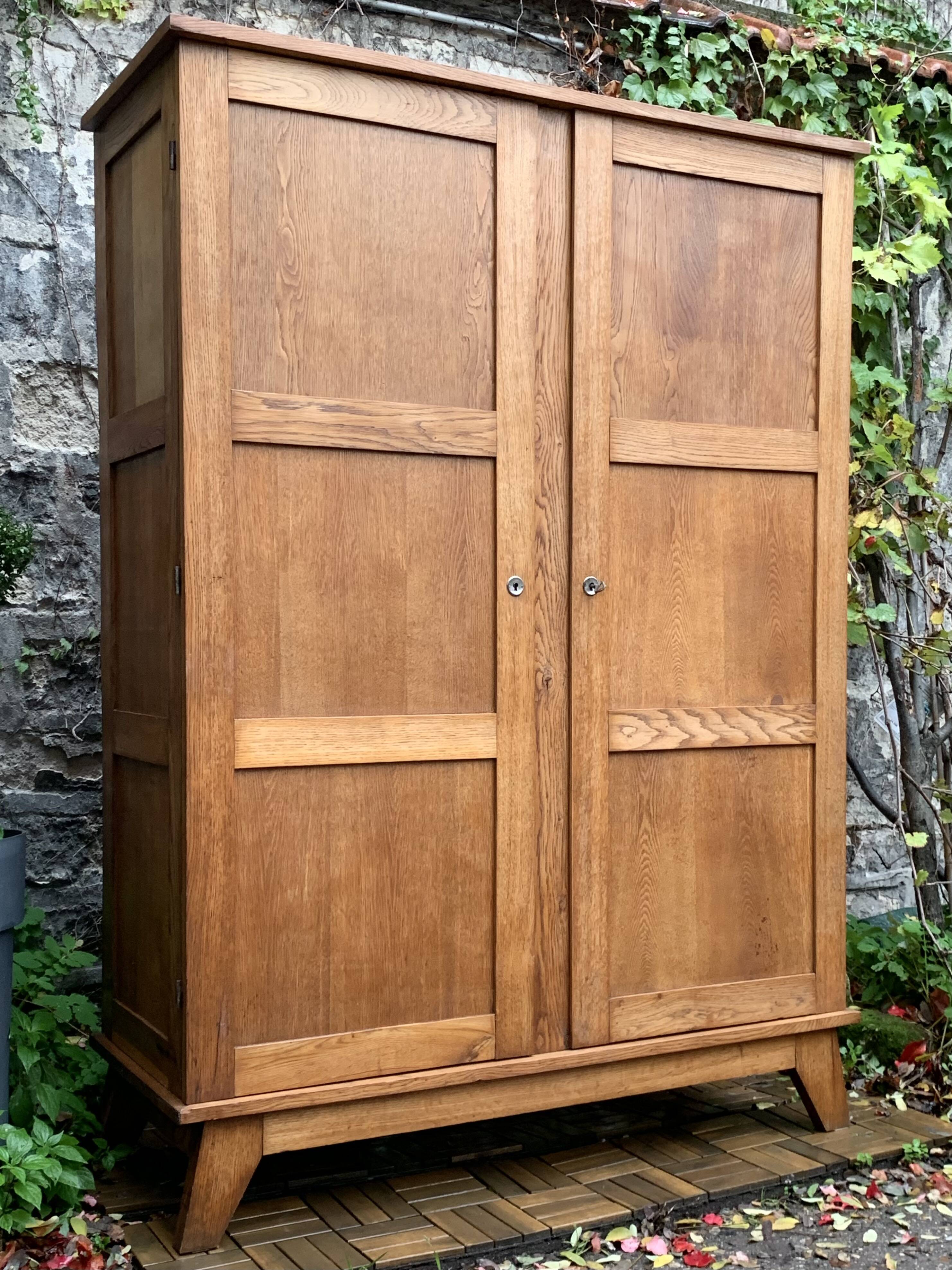 Solid oak compass foot cabinet René Gabriel 1945