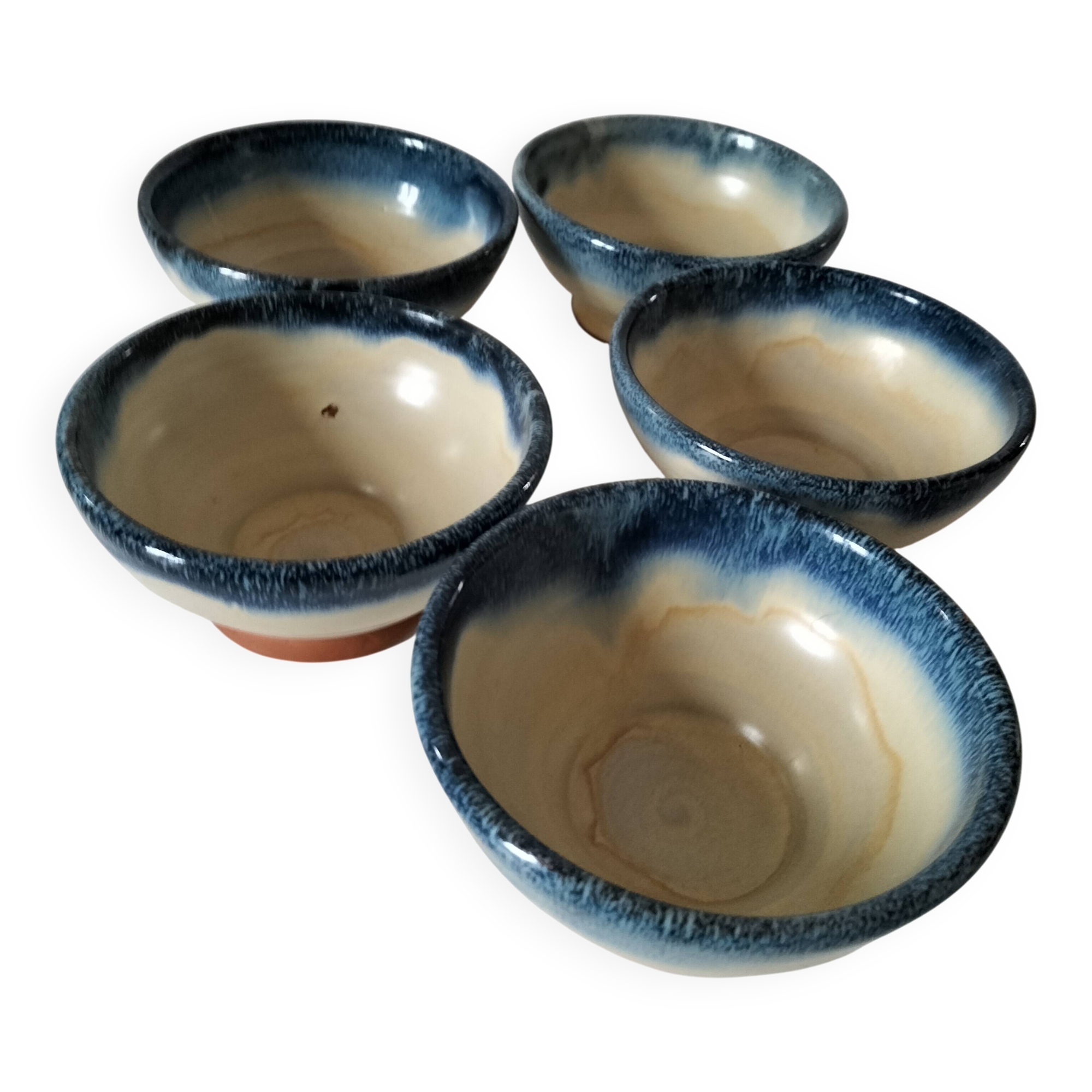 Set of 5 small blue and cream glazed stoneware bowls