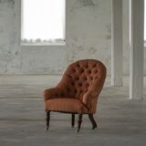 Victorian mahogany armchair, with wheels and coloured fabric, England, early 1900s.