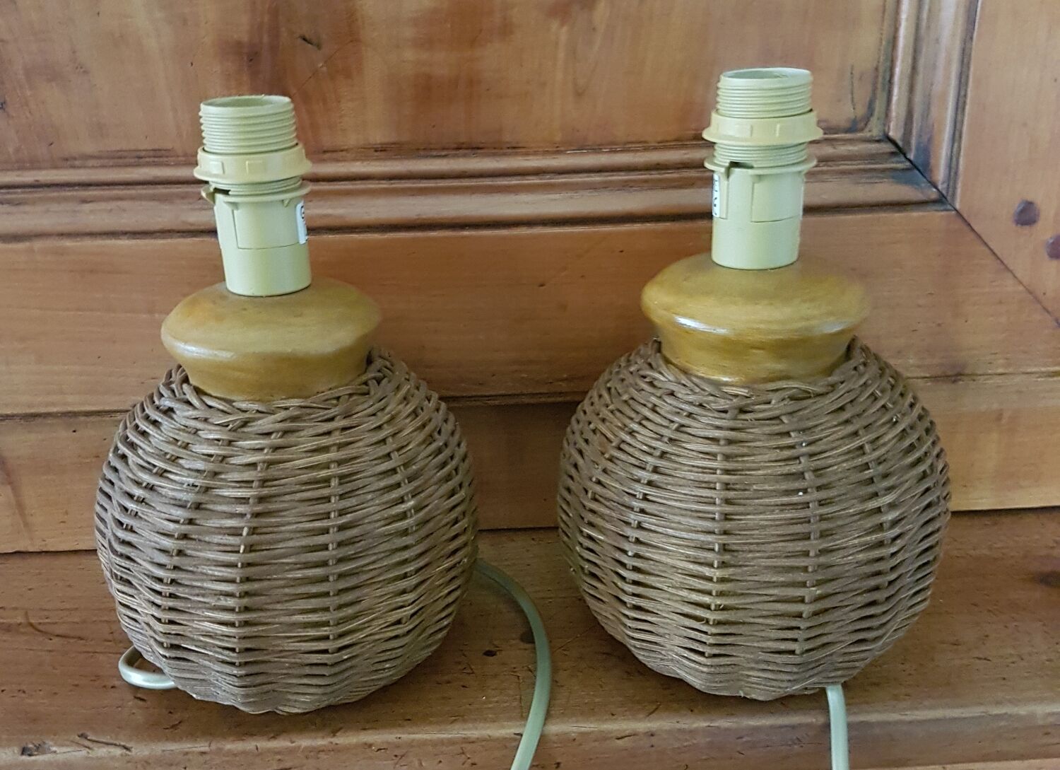 Pair of small ceramic lamps, dressed in rattan